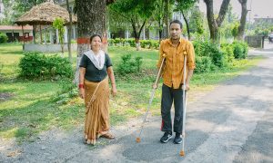 Khagendra practicing walking with his wife